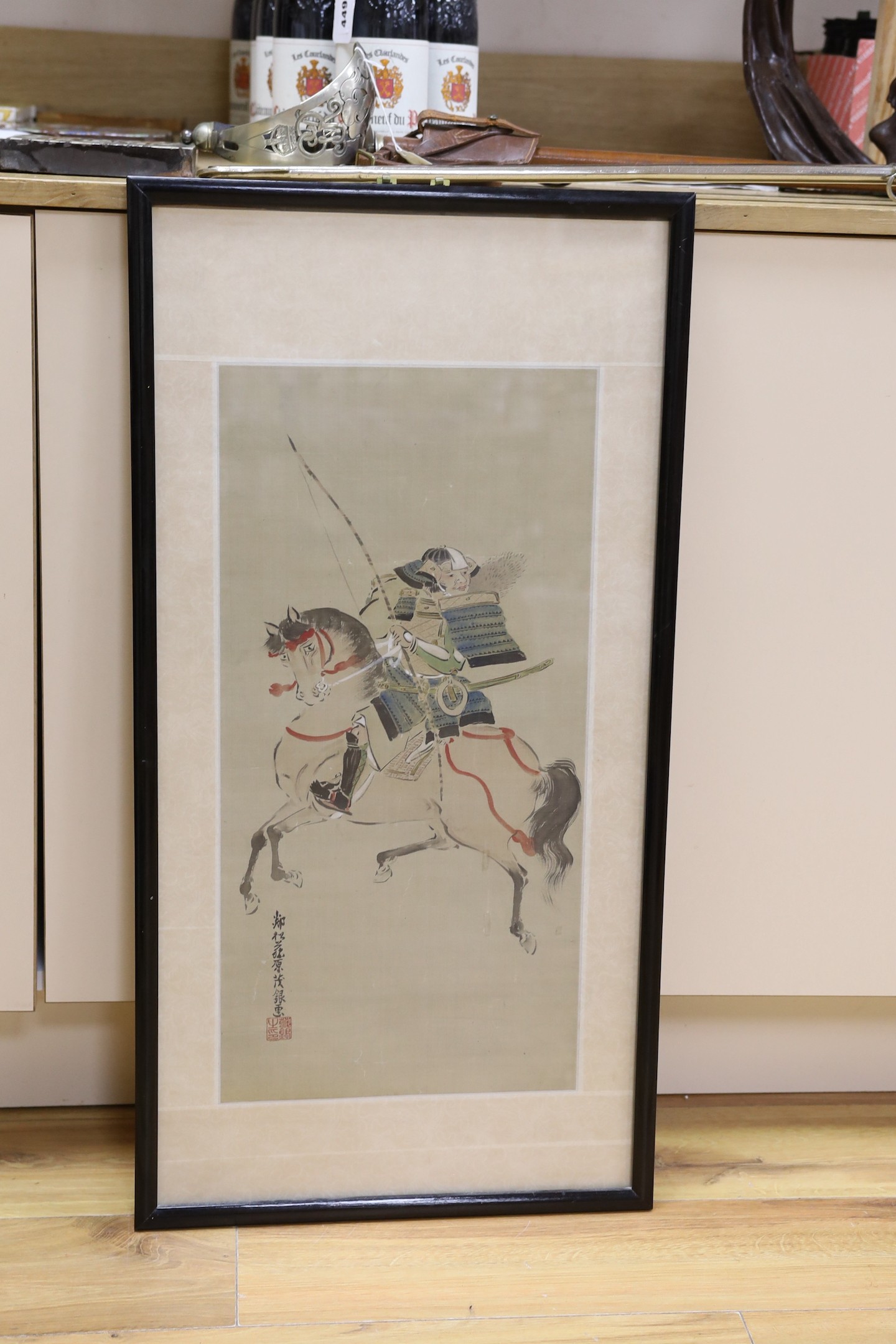 Japanese School, 19th century, Ink and colour on silk, Samurai on horseback, inscribed - 59 x 30cm